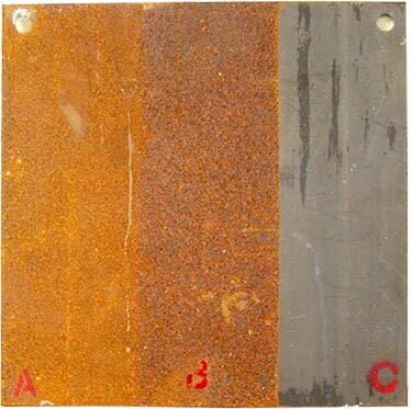 A section of metal on a ship. The untreated section is extremely rusted, the middle treated with typical treatment still rusted, and the section trated with Quik Tann is rust free.